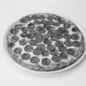 Pizza with toppings on white background, close-up