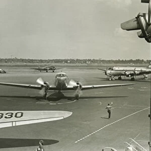 Planes on runway, (B&W), elevated view