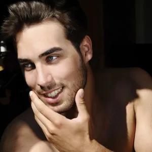 Portrait of a young man in sunlight, beauty shot