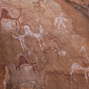 Prehistoric petroglyphs in libian Sahara desert Prehistoric petroglyphs in libian Sahara desert