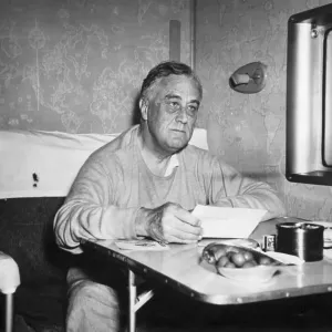 President Roosevelt Reading Dispatches Aboard Plane President Roosevelt Reading Dispatches Aboard Plane