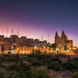 A purple sunset over the village of Mellieha, Malta A purple sunset over the village of Mellieha, Malta