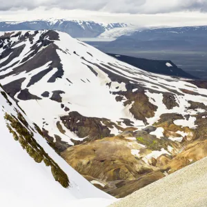 Rear view of man hiking down a mountain