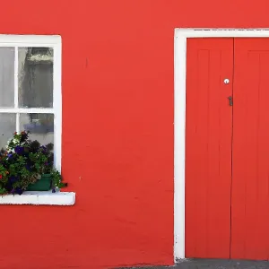 A Red Painted House With Flower Box In The Window A Red Painted House With Flower Box In The Window