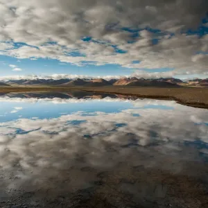 Reflection of sky over Namtso lake Reflection of sky over Namtso lake