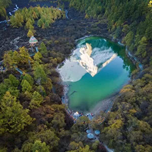 The reflection of snowy mountain on Zhuomala lake in Yading Nature Reserve, Sichuan