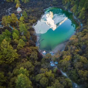 The reflection of snowy mountain on Zhuomala lake in Yading Nature Reserve, Sichuan The reflection of snowy mountain on Zhuomala lake in Yading Nature Reserve, Sichuan