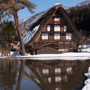 The reflection of traditional house in Shirakawa-go village, Japan The reflection of traditional house in Shirakawa-go village, Japan