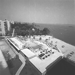 Resort swimming pools and beach, (B&W), elevated view