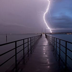 Retreating thunderstorm, left, and magic hour with lightning, right, jetty of Konstanz Therme, Lake Constance, Baden-Wuerttemberg, Germany, Europe, PublicGround
