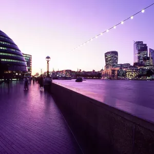Riverbank and the city skyline of London at dusk Riverbank and the city skyline of London at dusk