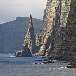 Rock pinnacle and cliff, west coast of Sandoy, Faroe Islands, Denmark