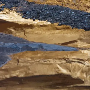 Rocks reflected in stream in Hunter Canyon, Moab, Utah, USA Rocks reflected in stream in Hunter Canyon, Moab, Utah, USA