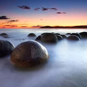 Round boulders in water