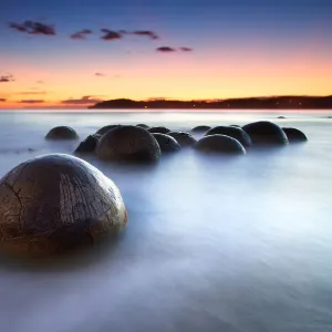 Round boulders in water