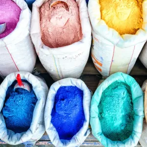 Sacks of wall tint and clothes in stores in Chefchaouen Sacks of wall tint and clothes in stores in Chefchaouen