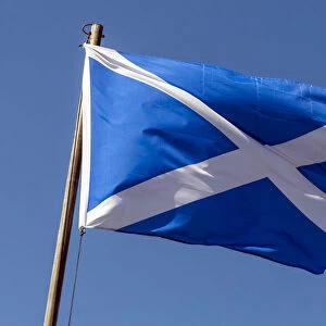 The Saltire, Scottish flag, flying against a blue sky, Oban, Scotland, United Kingdom