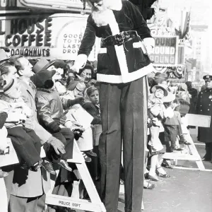 Santa Claus Stilt Walker with Crowd at Macy's Thanksgiving Parade Santa Claus Stilt Walker with Crowd at Macy's Thanksgiving Parade
