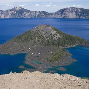 Scenic view of Wizard Island, a volcanic cinder cone, in Crater Lake, Crater Lake National Park, Oregon, USA Scenic view of Wizard Island, a volcanic cinder cone, in Crater Lake, Crater Lake National Park, Oregon, USA