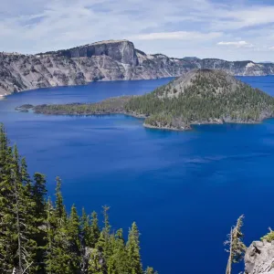 Scenic view of Wizard Island, a volcanic cinder cone, in Crater Lake, Crater Lake National Park, Oregon, USA Scenic view of Wizard Island, a volcanic cinder cone, in Crater Lake, Crater Lake National Park, Oregon, USA