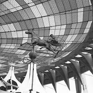 Sculpture of chariot under glazed roof, (B&W), low angle view