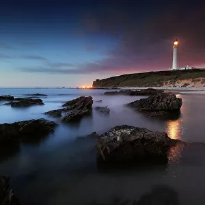 Seascape at midnight with lighthouse lossiemouth