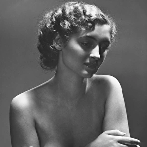 Semi naked woman posing in studio, (B&W), portrait