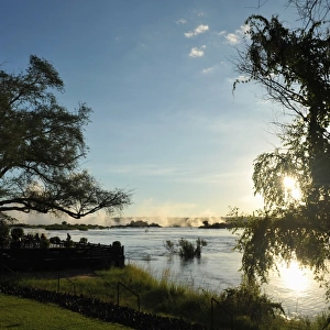 Serene view overlooking The Victoria Falls in Zambia at sunset