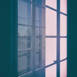 Shadows of a window projected on a blind, in Winter, in the city of Nice, France Shadows of a window projected on a blind, in Winter, in the city of Nice, France