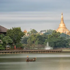 Shwedagon Pagoda in the morning view at wooden boardwalk at the Kandawgyi Lake in Yangon, Myanmar