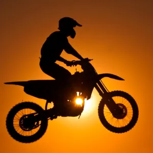 Silhouette of motocross at sunset