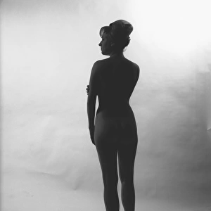 Silhuette of nude woman posing in studio, (Rear view), (B&W)
