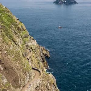 Skellig Michael (Great Skellig), Skellig islands, County Kerry, Munster province, Ireland, Europe. The trail on the cliff with the little Skellig on the background Skellig Michael (Great Skellig), Skellig islands, County Kerry, Munster province, Ireland, Europe. The trail on the cliff with the little Skellig on the background