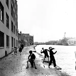 Skimming Stones; A group of children playing in the racially diverse dockland area of Cardiff