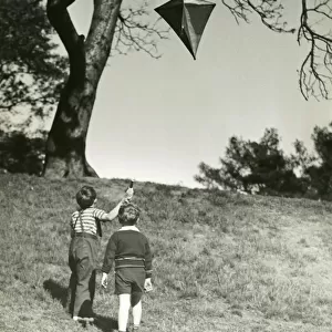 Small boys flying kite