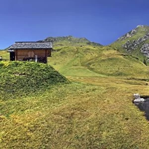 Small lake or pond at Mt Peitlerkofel, Sasso delle Putia, with mountain hut, Villnoess, Funes, Dolomites, South Tyrol, Italy, Europe