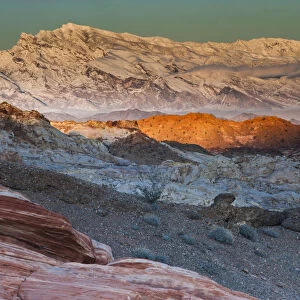 Snow covered mountains and different geological layers of rock, Valley of Fire State Park, Nevada, USA