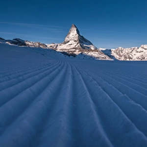 Snow ski track pattern with Matterhorn background