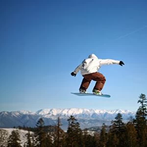 Snowboarder jumping at Mammoth Mountain Resort