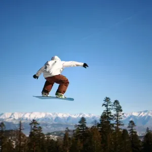 Snowboarder jumping at Mammoth Mountain Resort Snowboarder jumping at Mammoth Mountain Resort