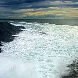 Spray in a ship wake at sea, at sunset, North Sea