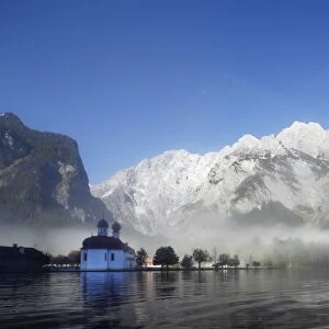 St. Bartholomae church, morning fog on Lake Koenigssee, Mt. Watzmann, Nationalpark Berchtesgaden national park, Berchtesgadener Land, Upper Bavaria, Bavaria, Germany, Europe