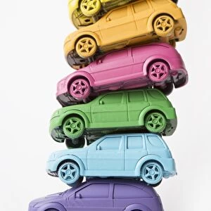Stack of rainbow colored cars