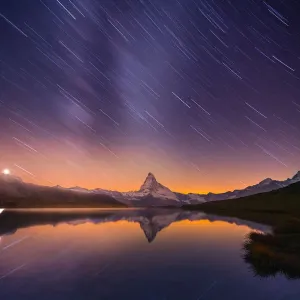 Startrail at Stellisee lake with Matterhorn background Startrail at Stellisee lake with Matterhorn background