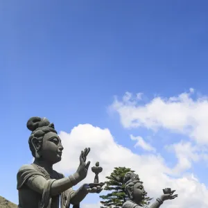 Statues of Devas making offerings at Tian Tan Buddha image at Po Lin Monastery, Lantau Island, Hong Kong, China