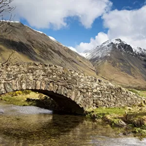 Stone bridge in mountain landscape, Lake District, Cumbria, England