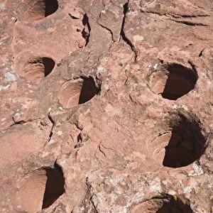 Stone panel with holes from the original inhabitants in the national park, Parque Nacional Talampaya, Argentina, South America