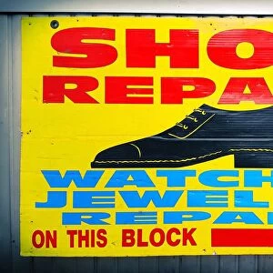 Store sign of shoe repair shop in New York City, USA