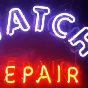 Store sign of watch repair shop in New York City, USA