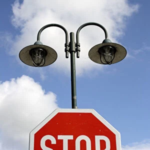 Street lamps and a stop sign